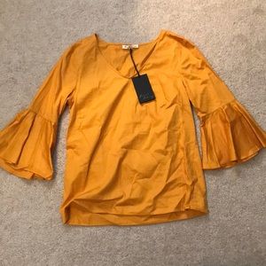 Canary trumpet sleeve blouse